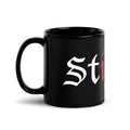 Caneca preta brilhante com logotipo oficial da Stigma
